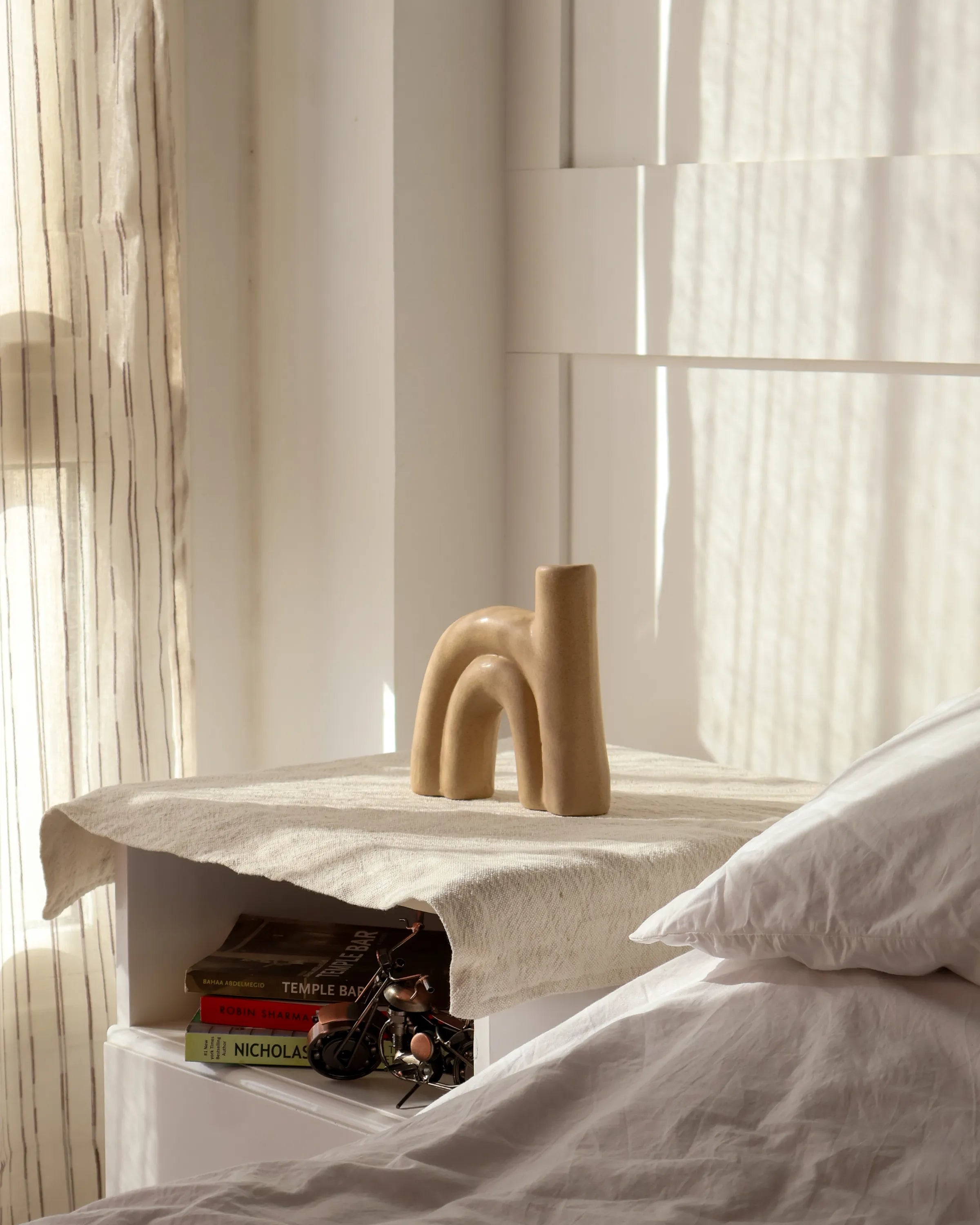 Handcrafted Arcus decor piece in beige finish by Stonia.