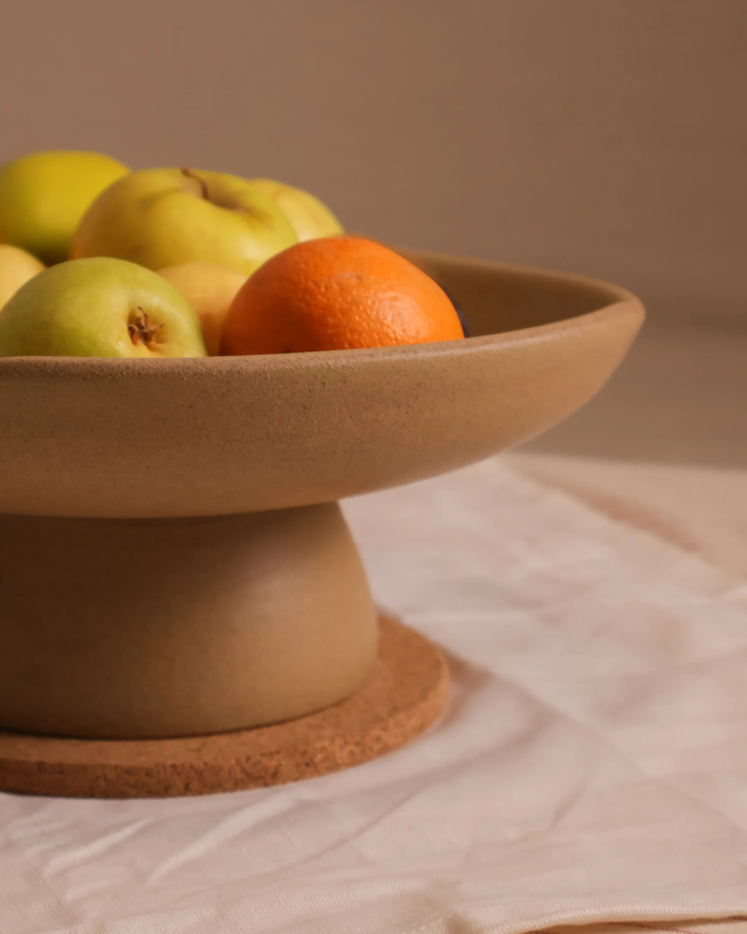 Handcrafted CALMA serving plate in beige finish by Stonia.