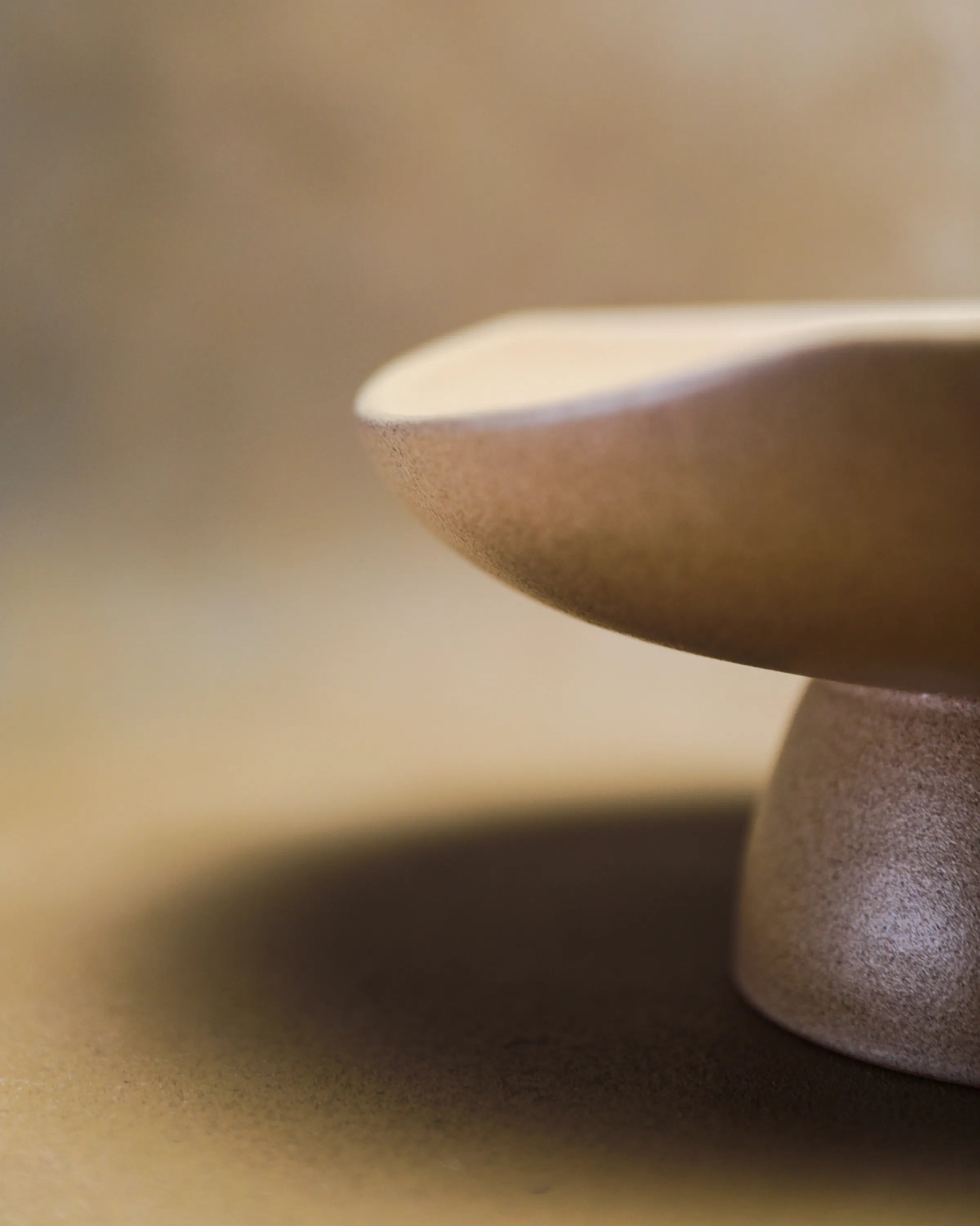 Handcrafted CALMA serving plate in beige finish by Stonia.