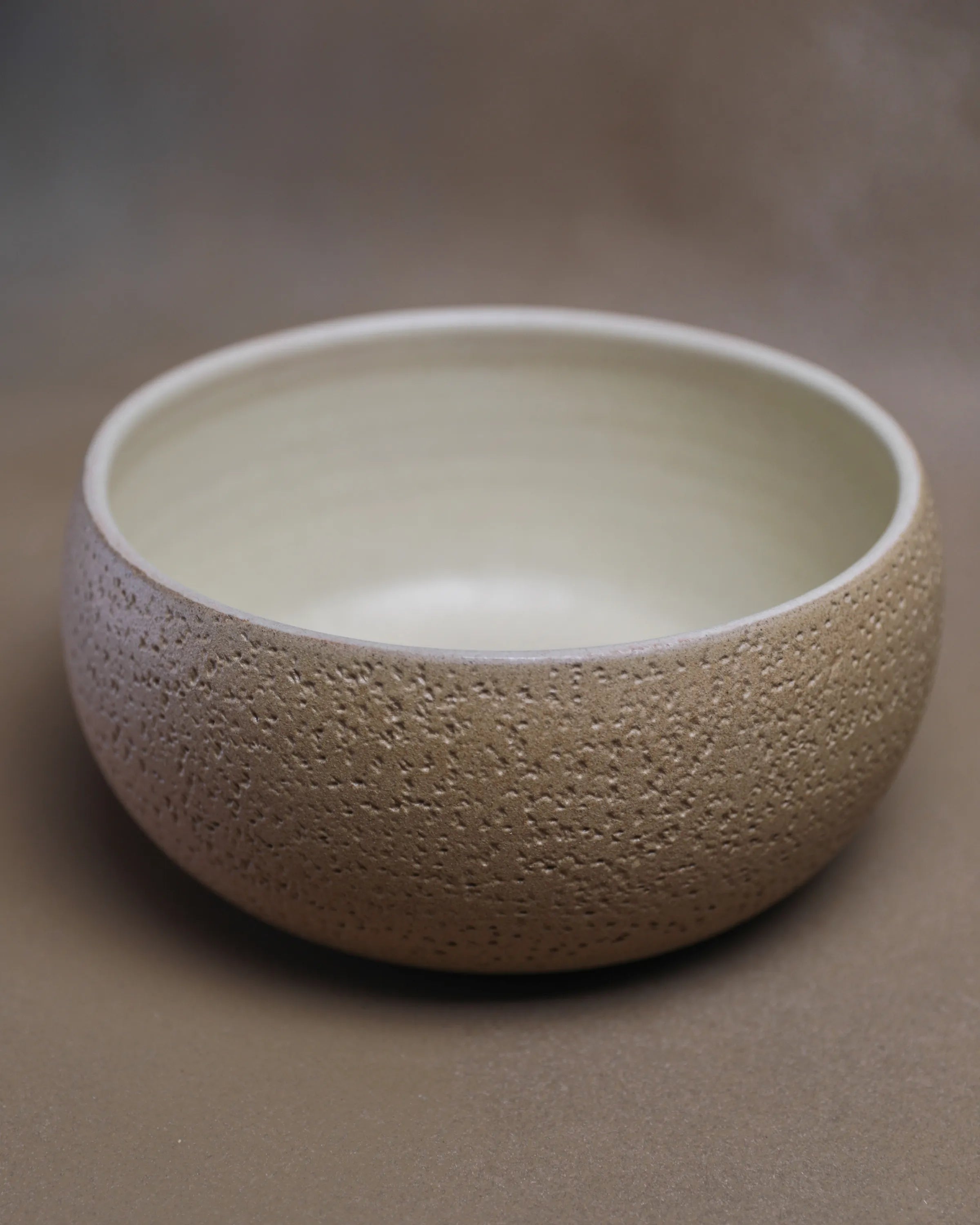 Handcrafted CRUSTY BOWL in beige by Stonia.