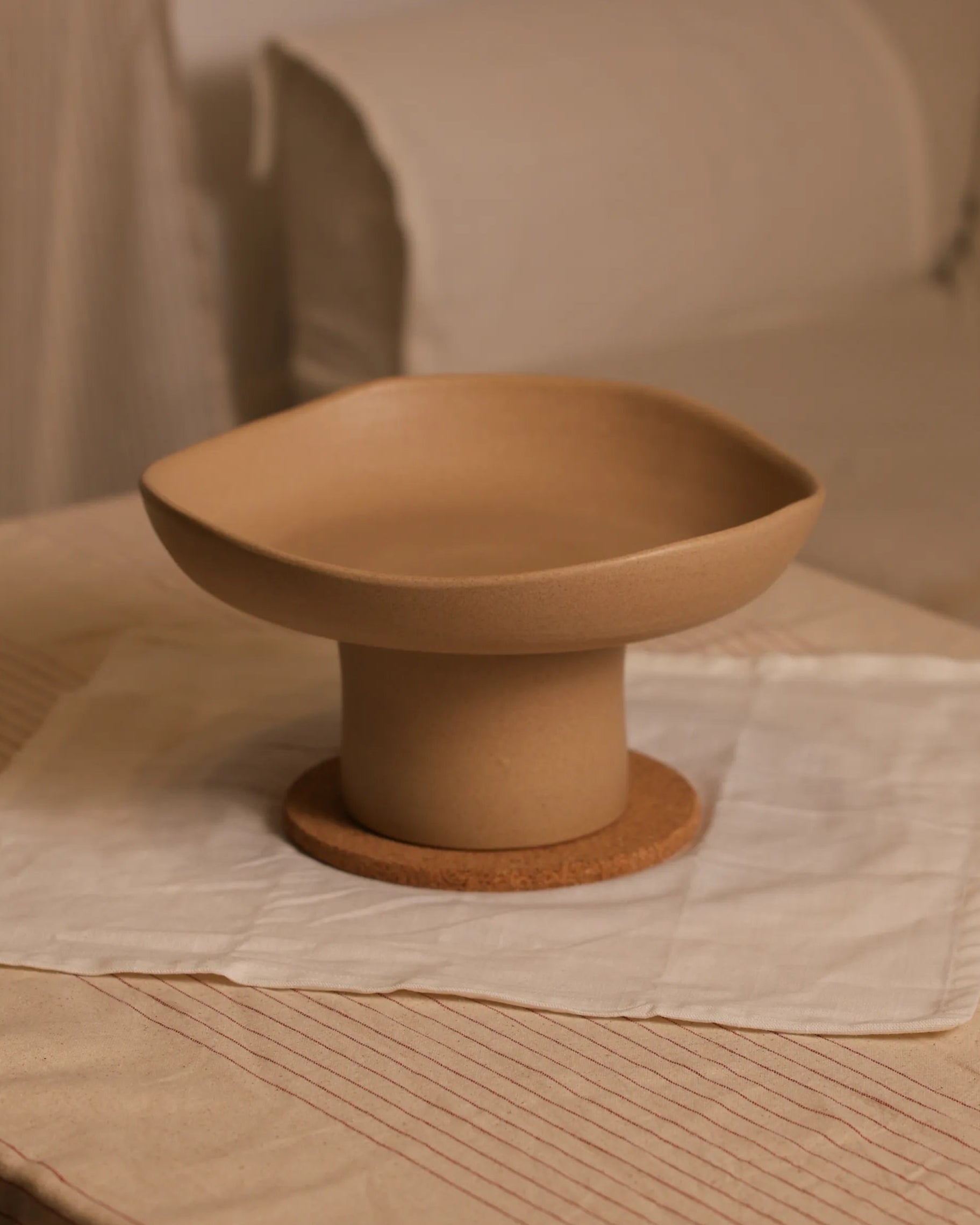 Handcrafted FLORA serving plate in beige finish by Stonia.