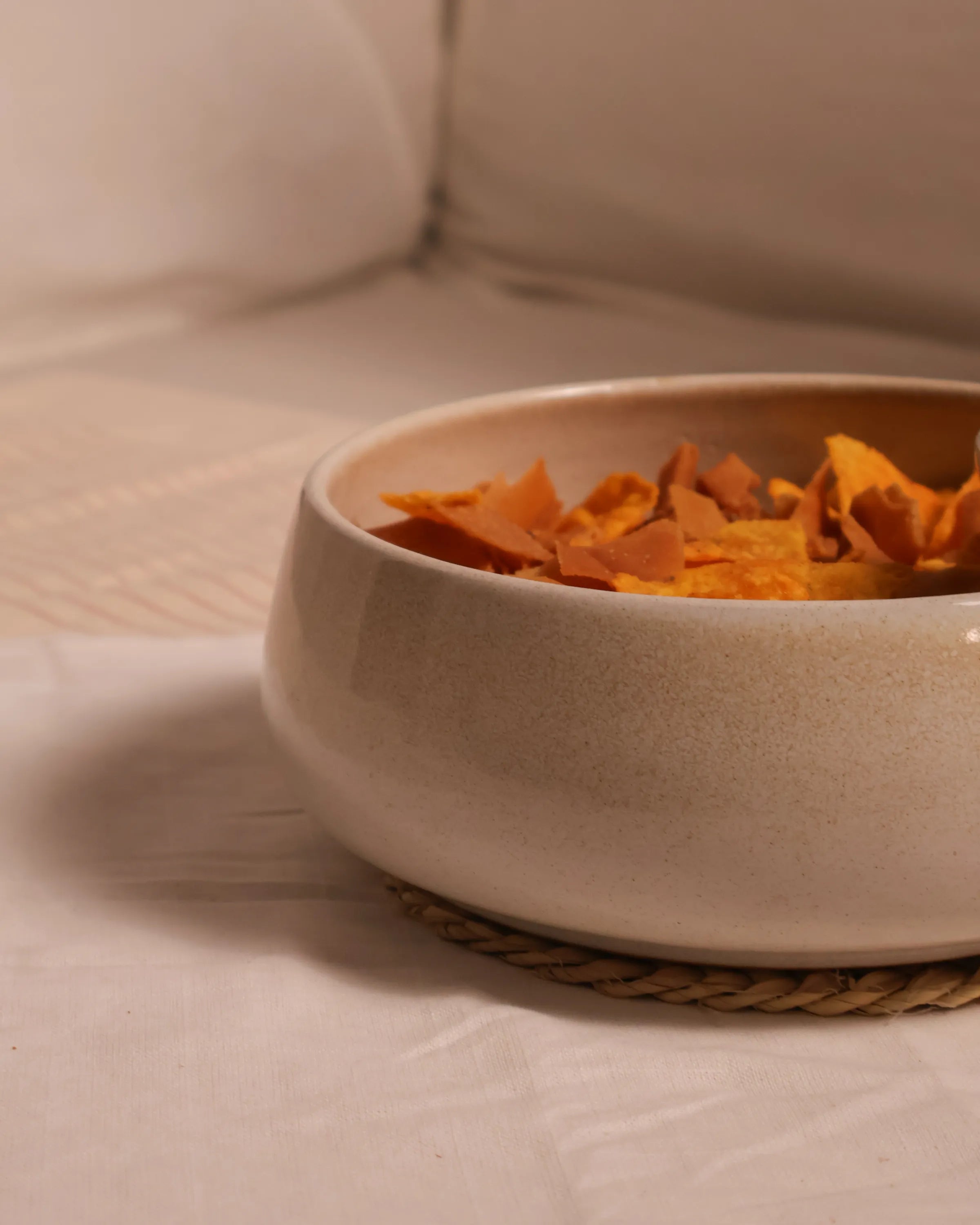 Handcrafted NEST serving plate in light beige finish by Stonia.