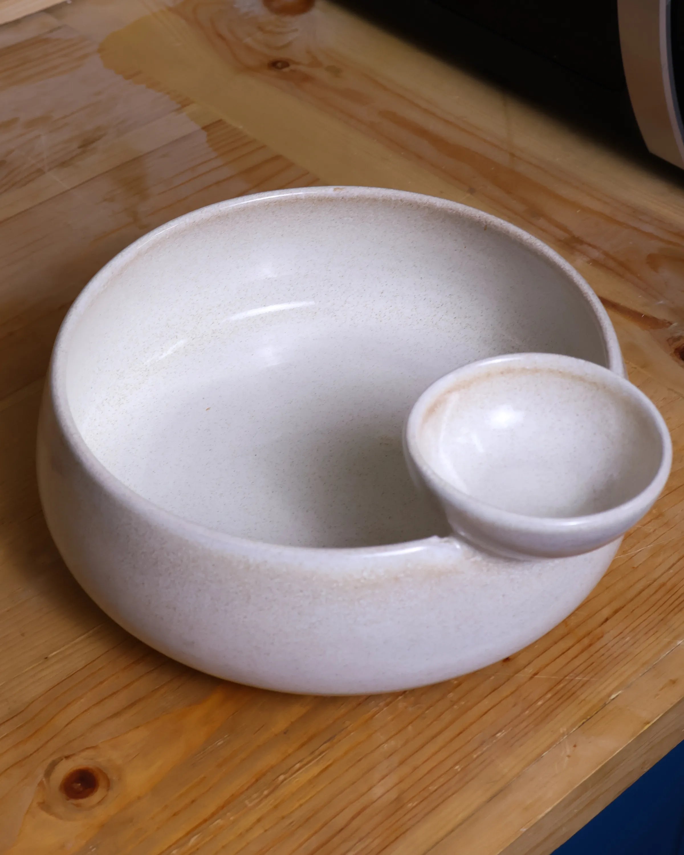 Handcrafted NEST serving plate in light off white finish by Stonia.