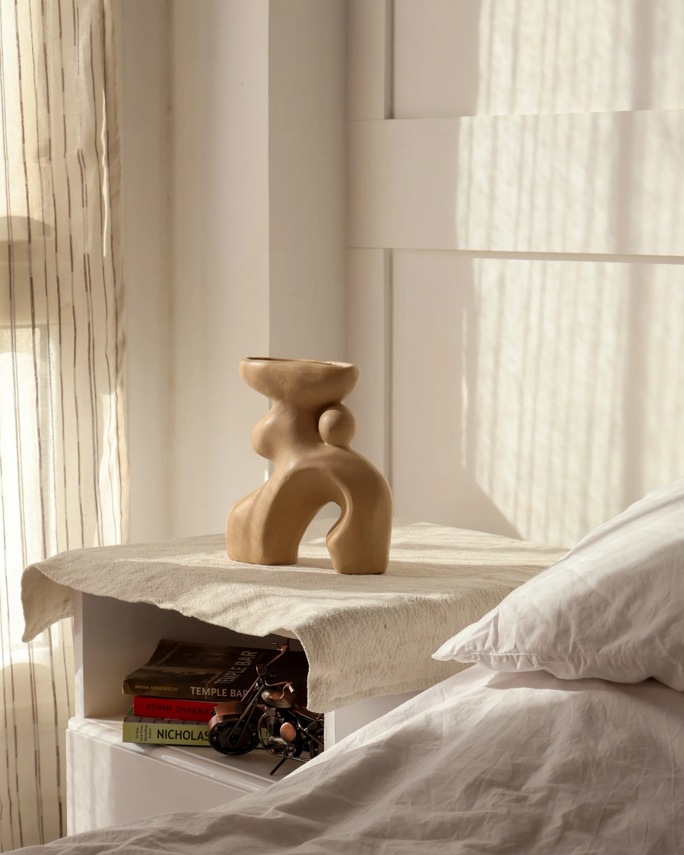 Handcrafted Oddie decor piece in beige finish by Stonia.