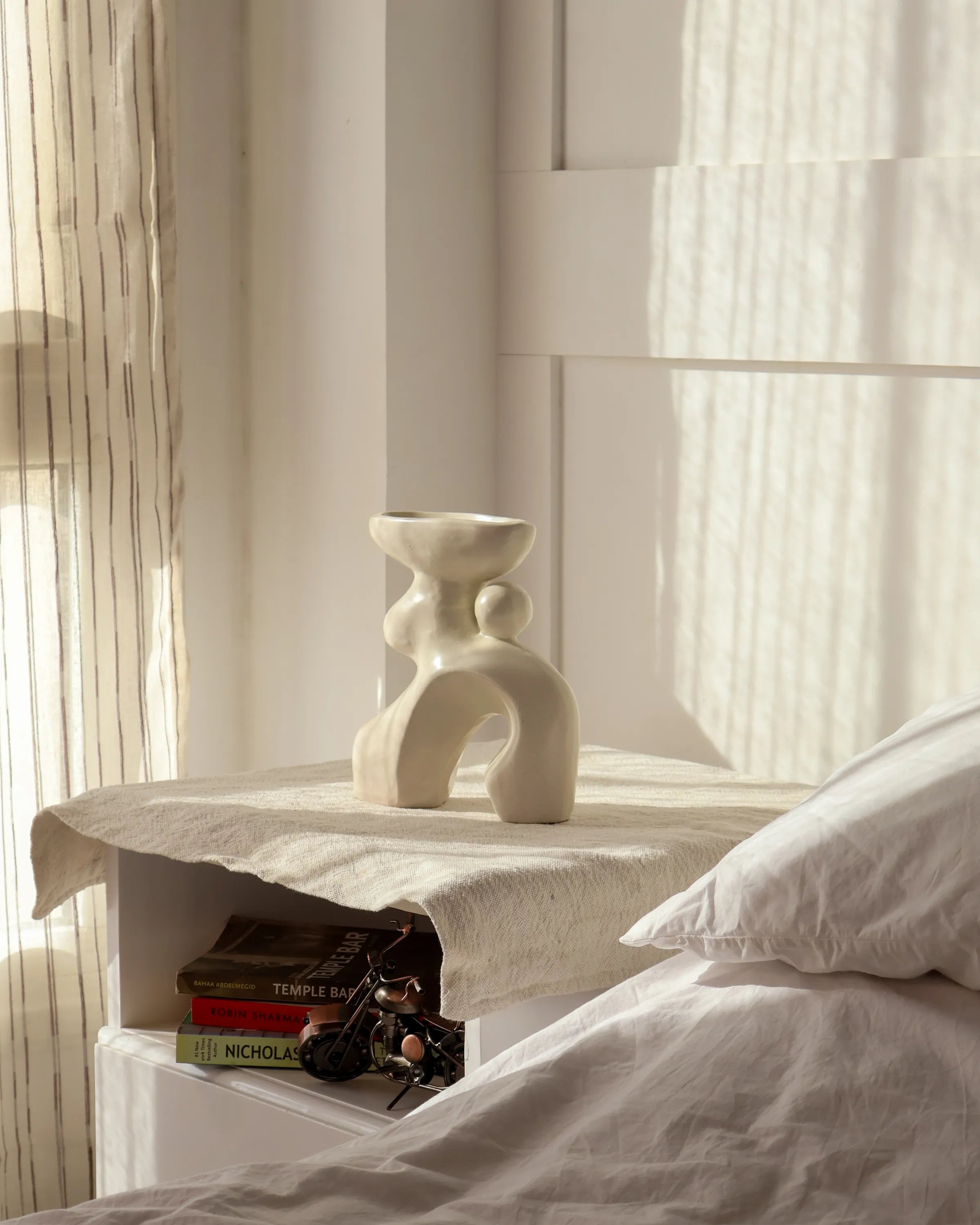 Handcrafted Oddie decor piece in off white finish by Stonia.