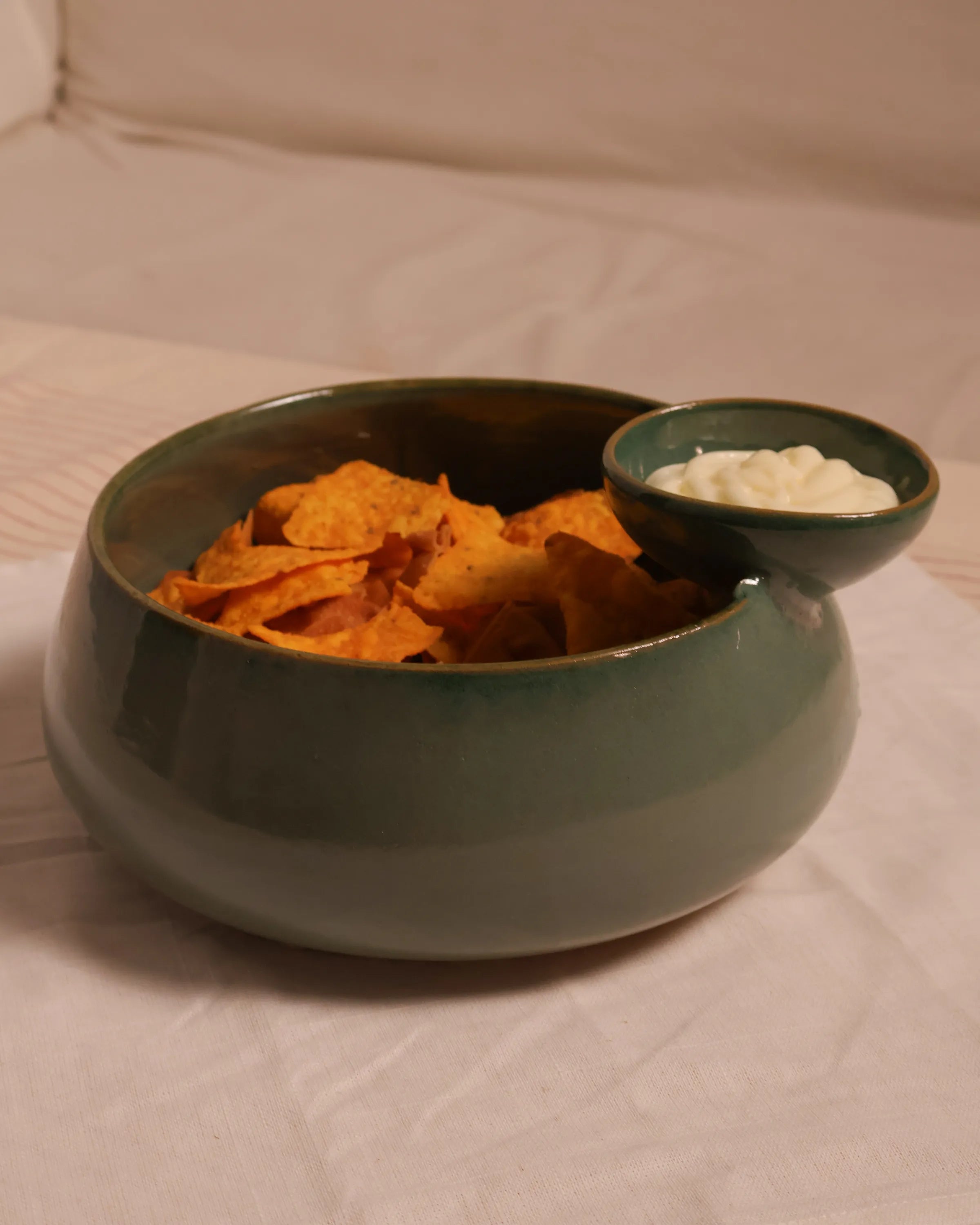 Handcrafted ORBIT serving plate in olive green finish by Stonia.