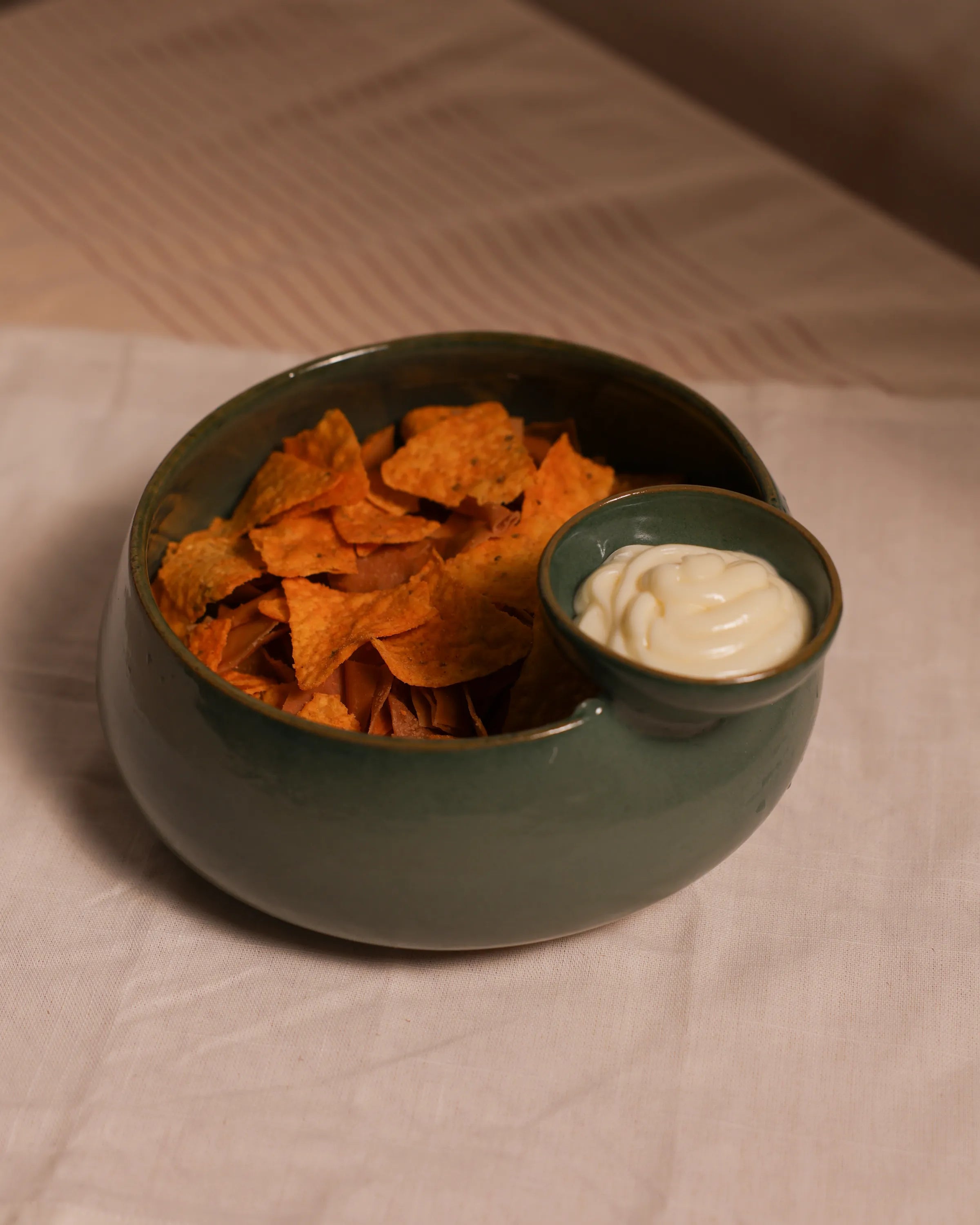Handcrafted ORBIT serving plate in olive green finish by Stonia.