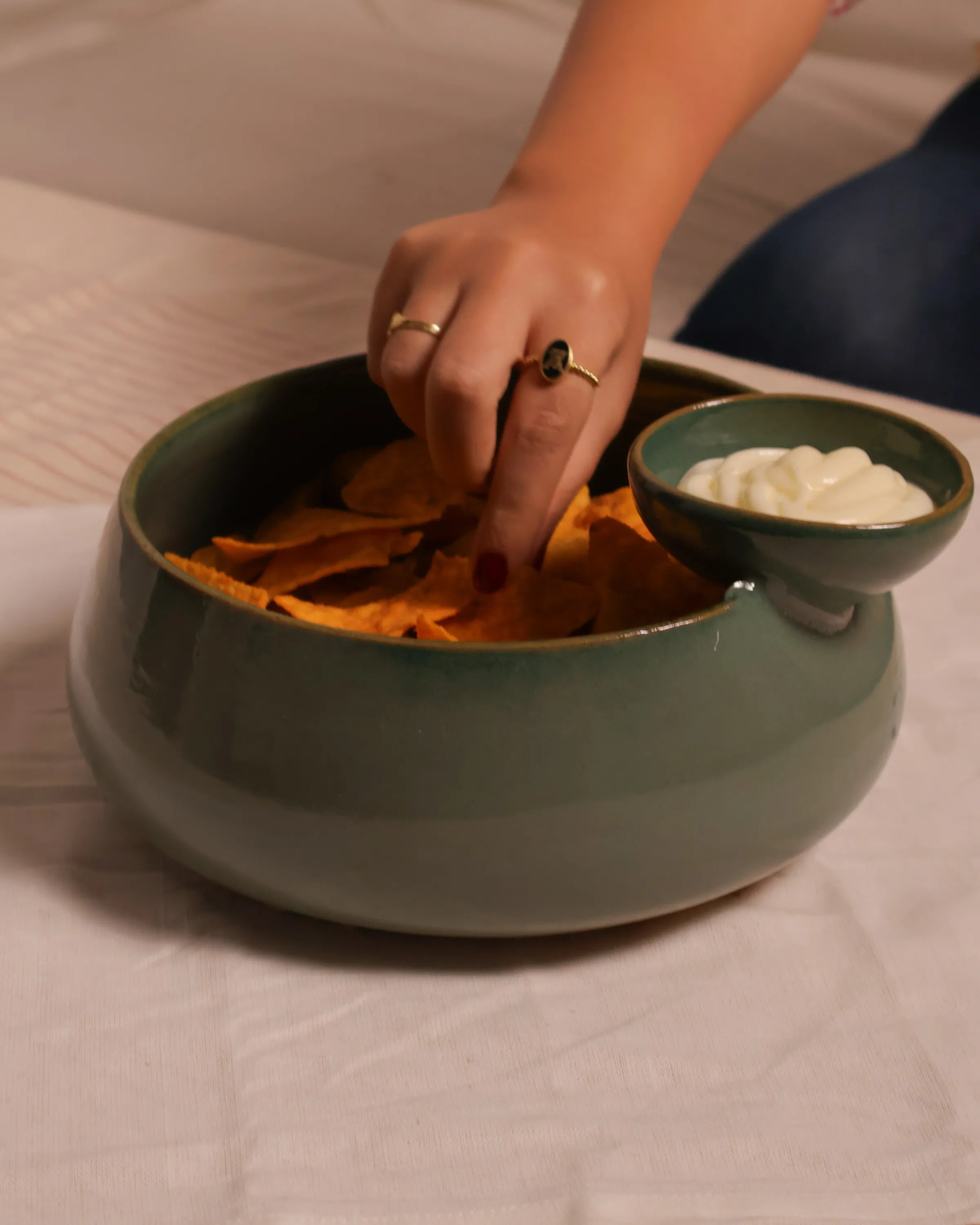 Handcrafted ORBIT serving plate in olive green finish by Stonia.