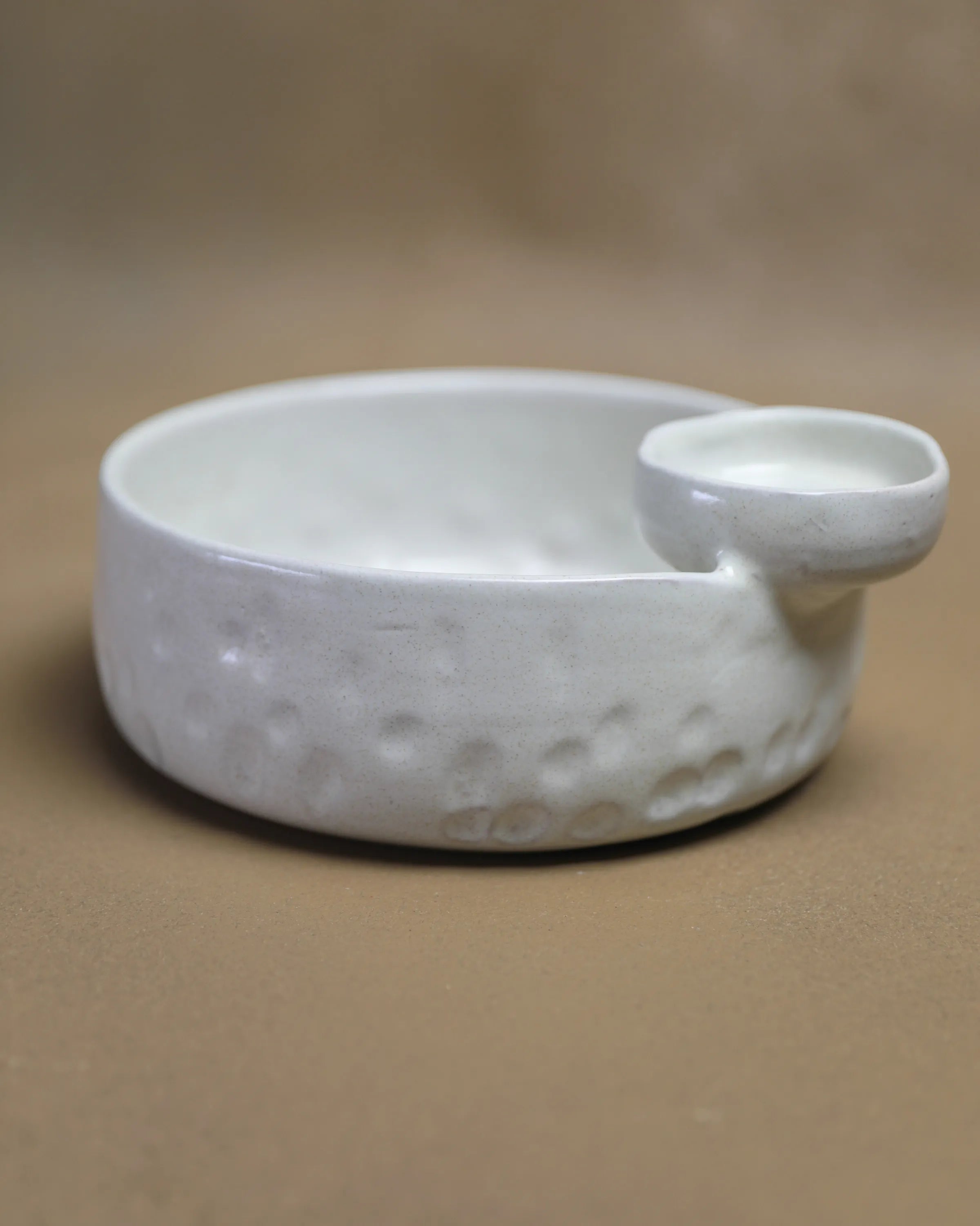 Handcrafted Saucy Bowl serving plate in off white finish by Stonia.