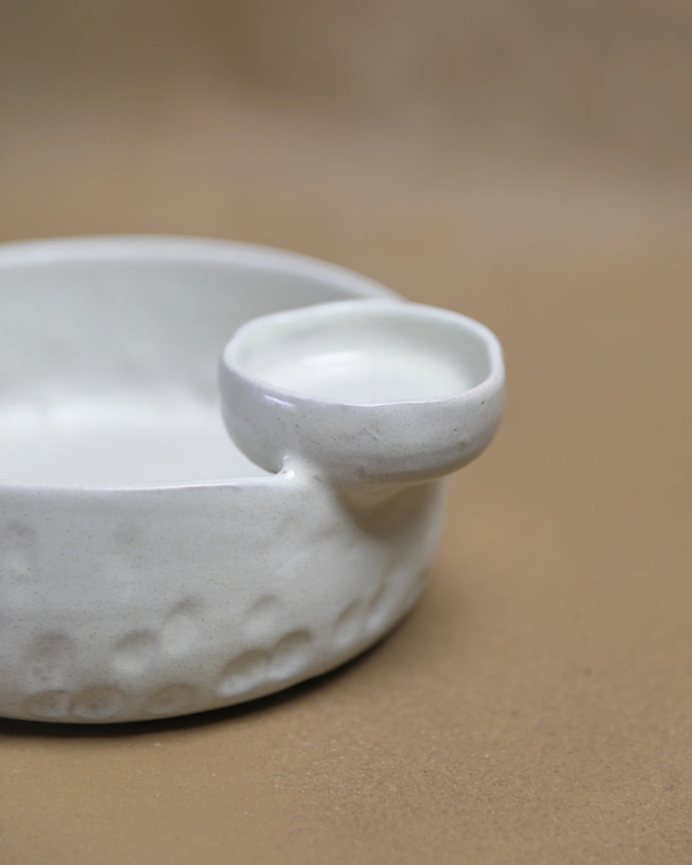 Handcrafted Saucy Bowl serving plate in off white finish by Stonia.