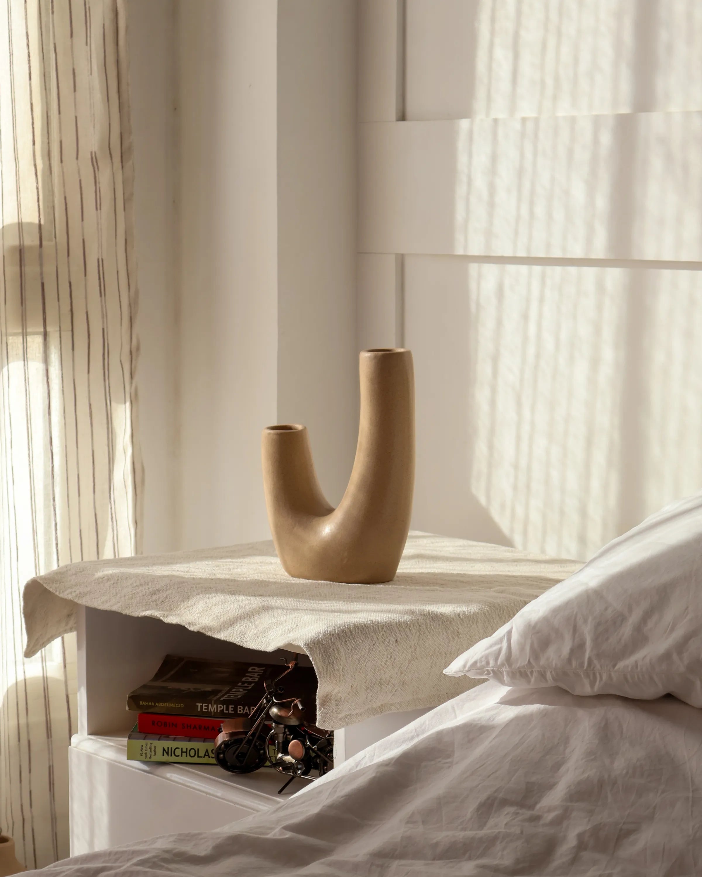 Handcrafted Swingy decor piece in beige finish by Stonia.