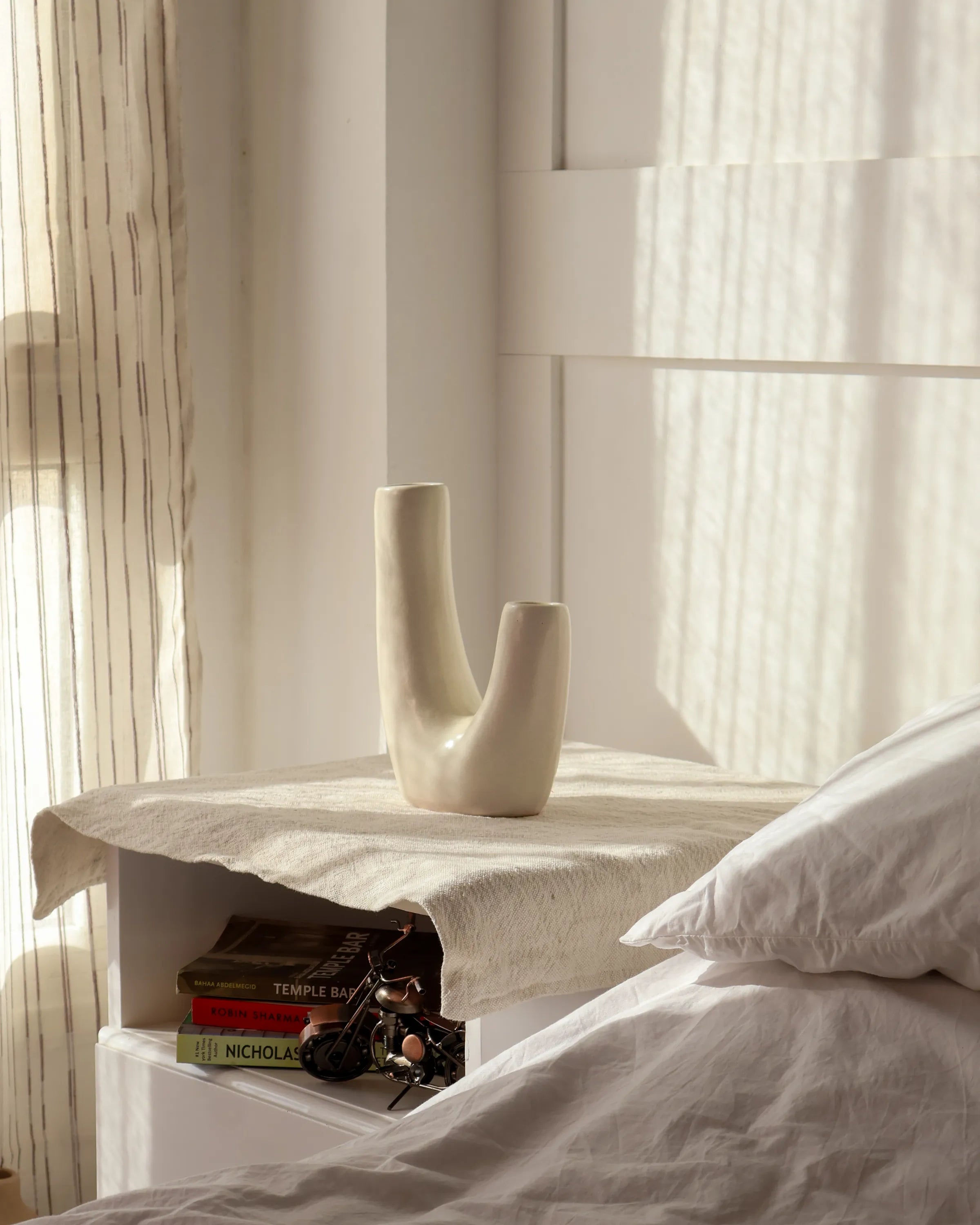 Handcrafted Swingy decor piece in off white finish by Stonia.