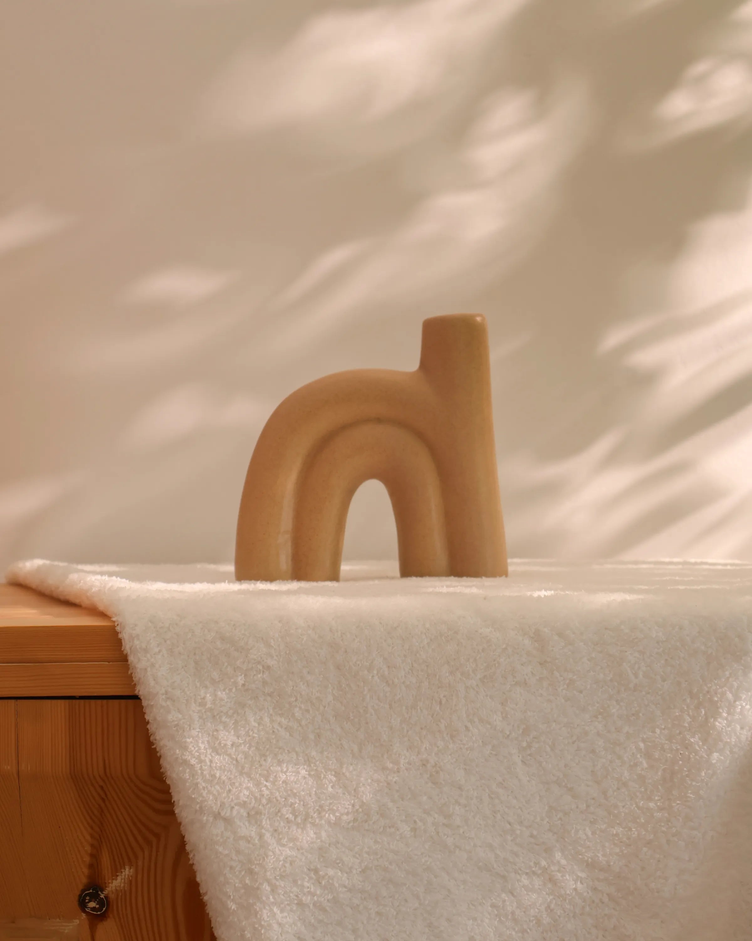 Handcrafted Arcus decor piece in beige finish by Stonia.