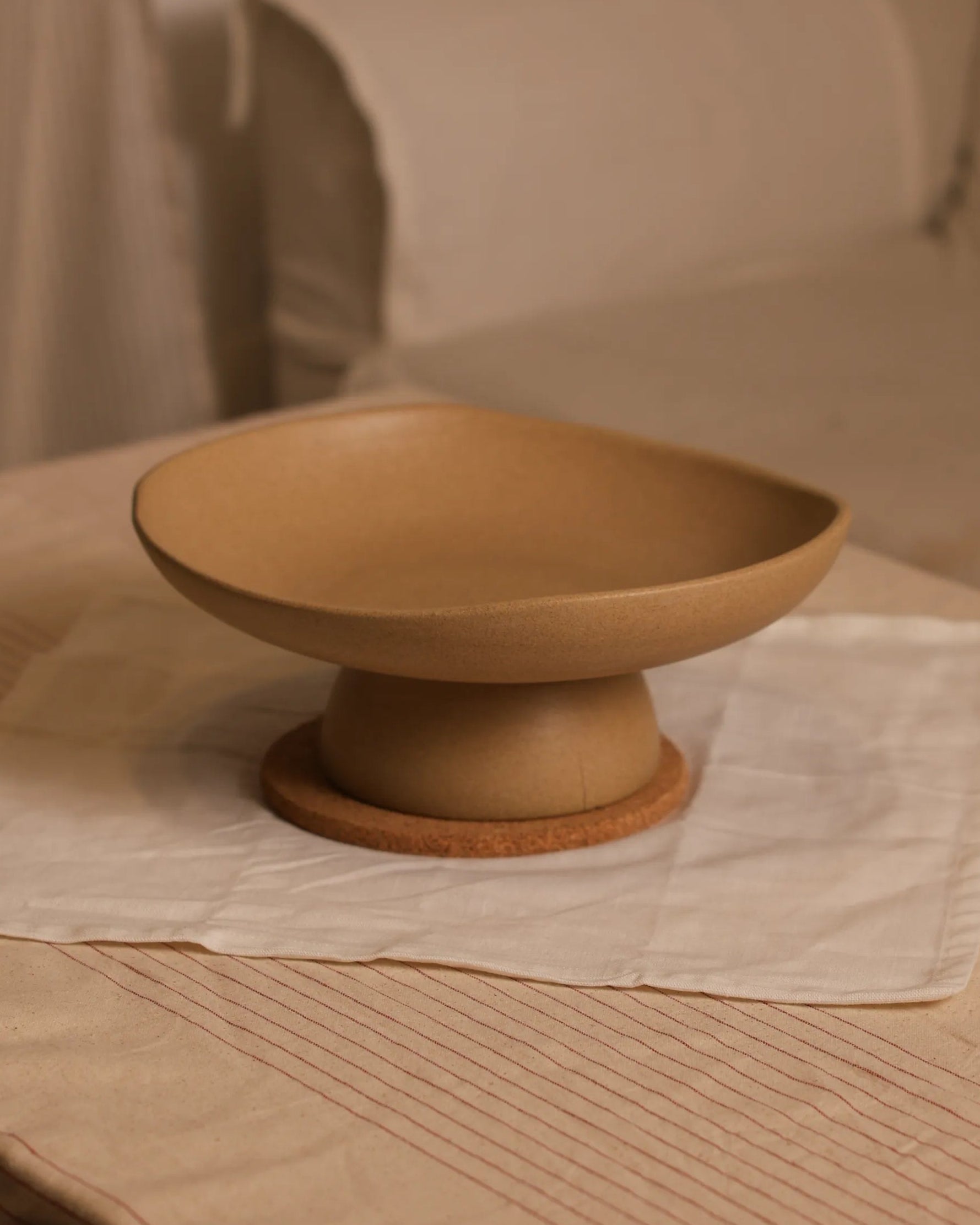 Handcrafted CALMA serving plate in beige finish by Stonia.
