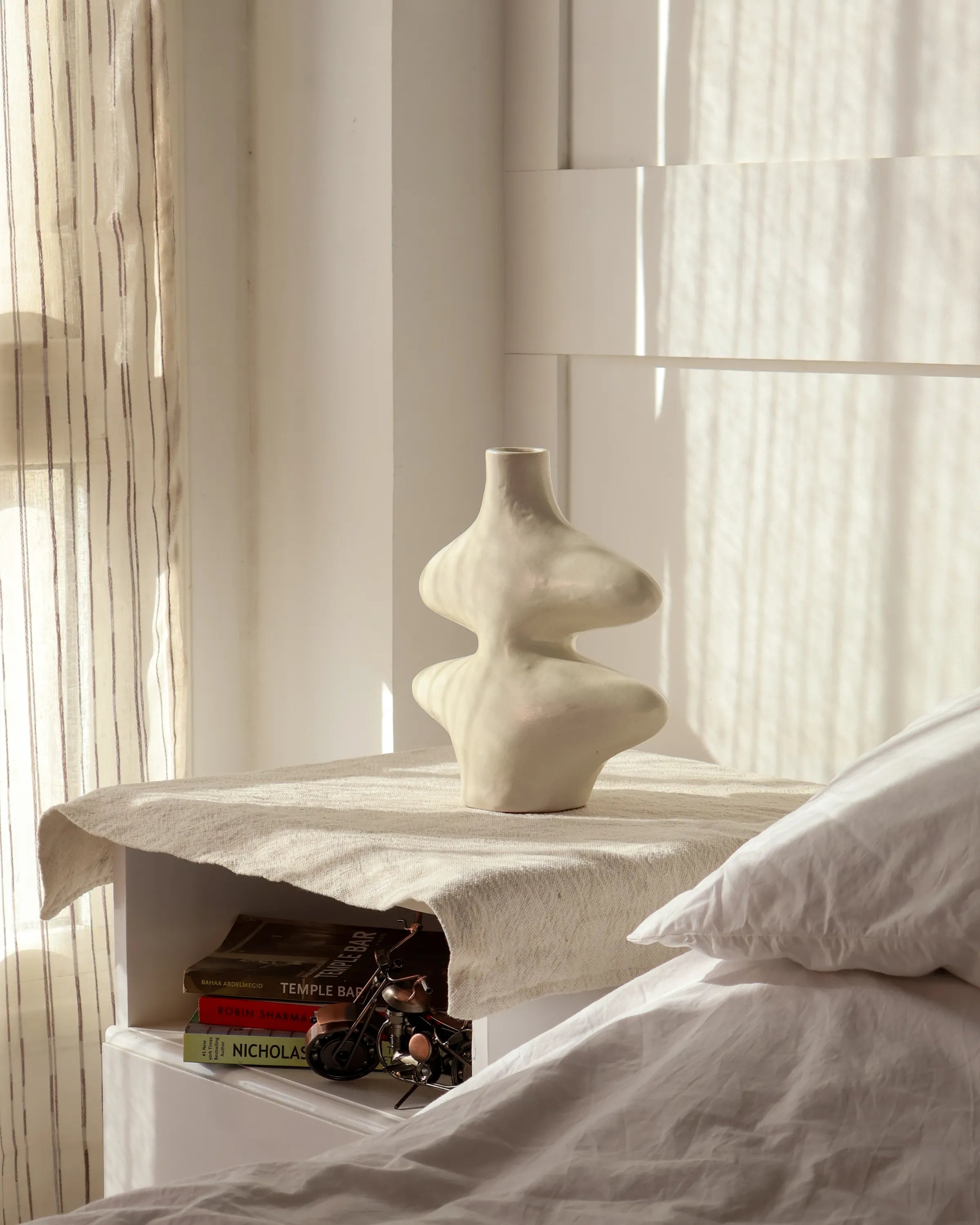 Handcrafted Curvy vase decor piece in off white finish by Stonia.