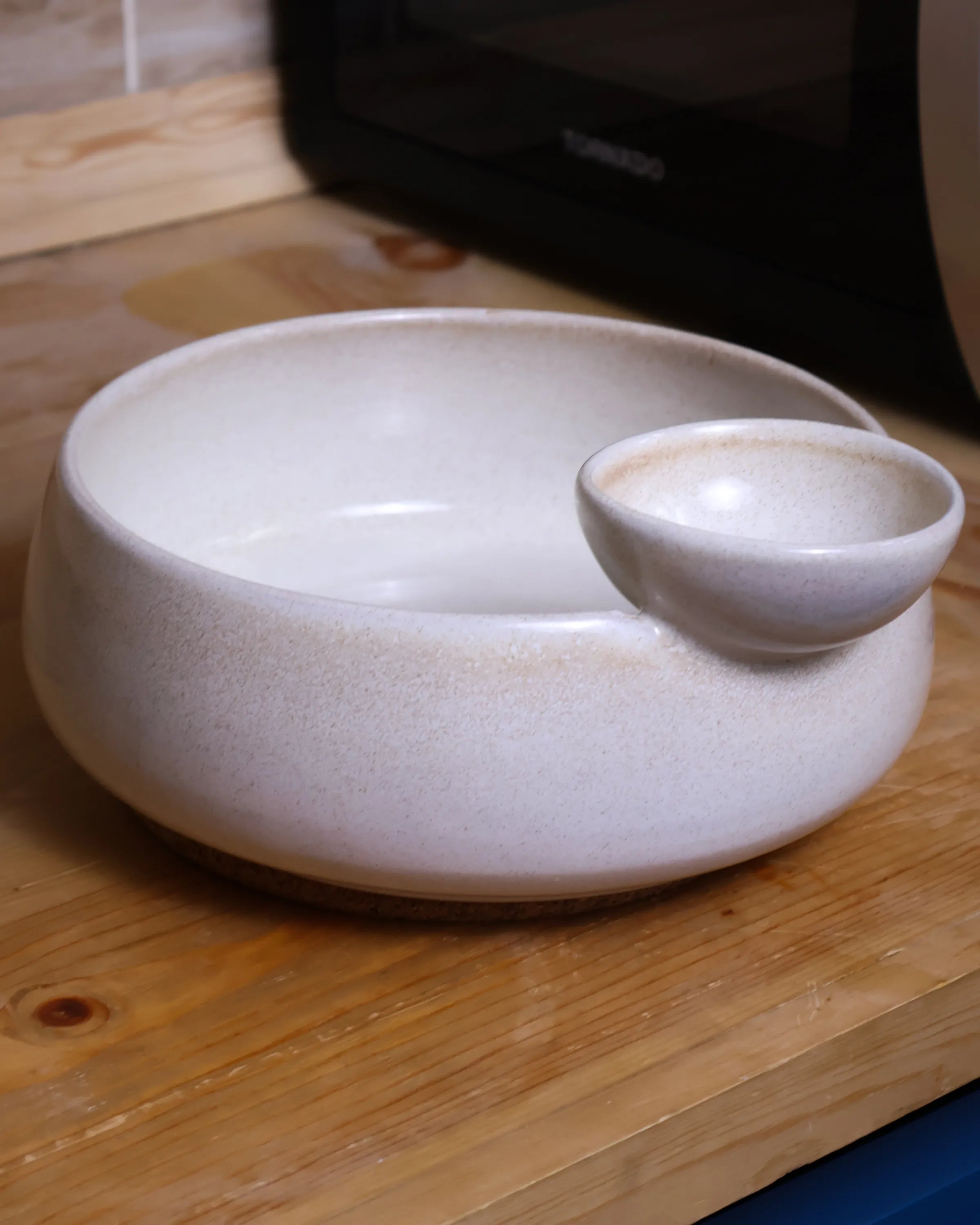 Handcrafted NEST serving plate in light off white finish by Stonia.