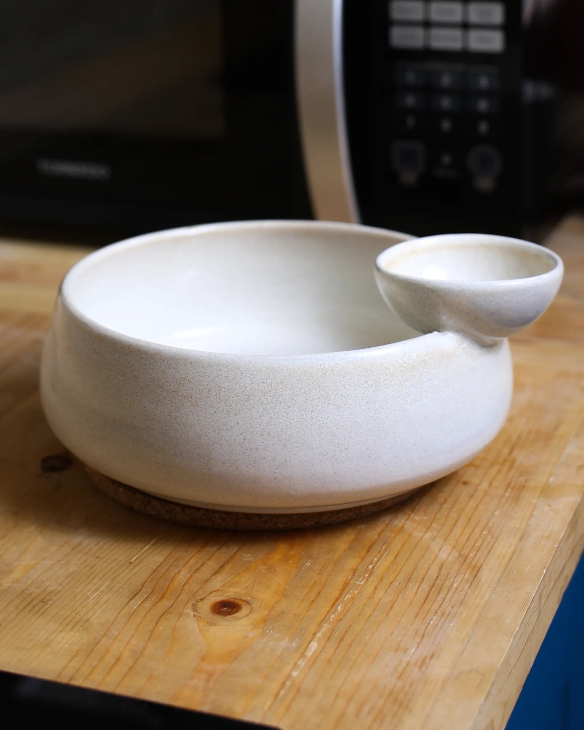 Handcrafted NEST serving plate in light off white finish by Stonia.