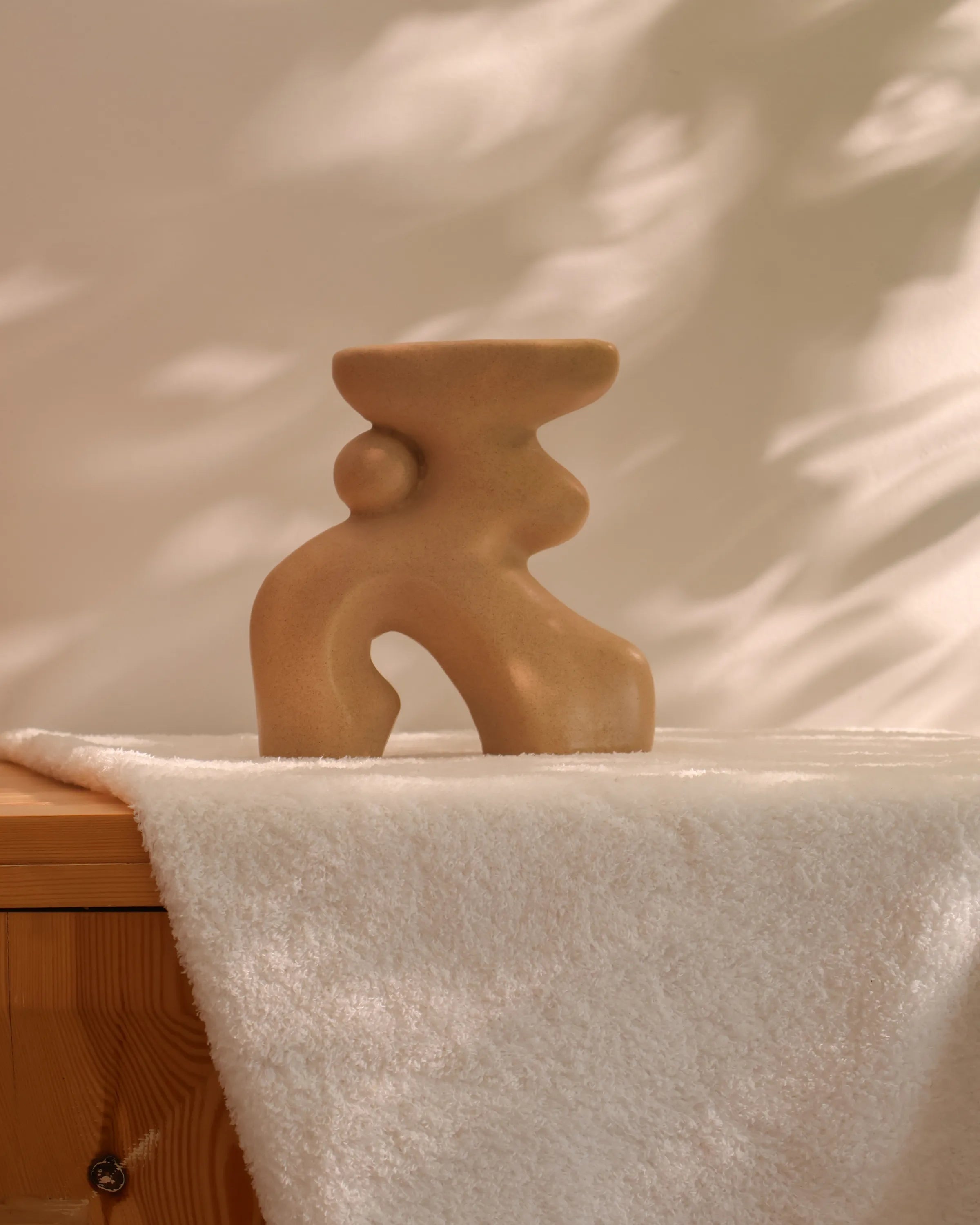 Handcrafted Oddie decor piece in beige finish by Stonia.