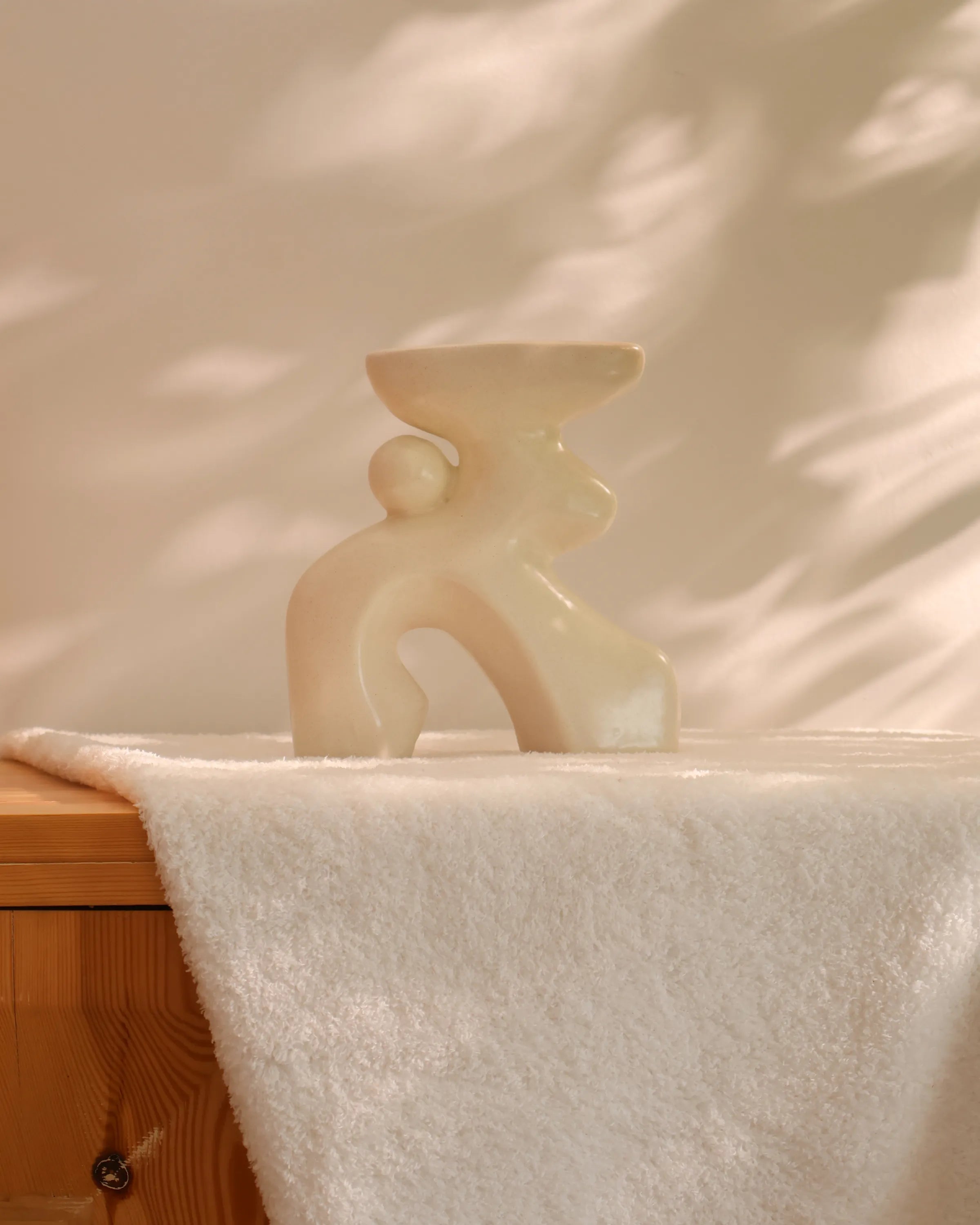 Handcrafted Oddie decor piece in off white finish by Stonia.