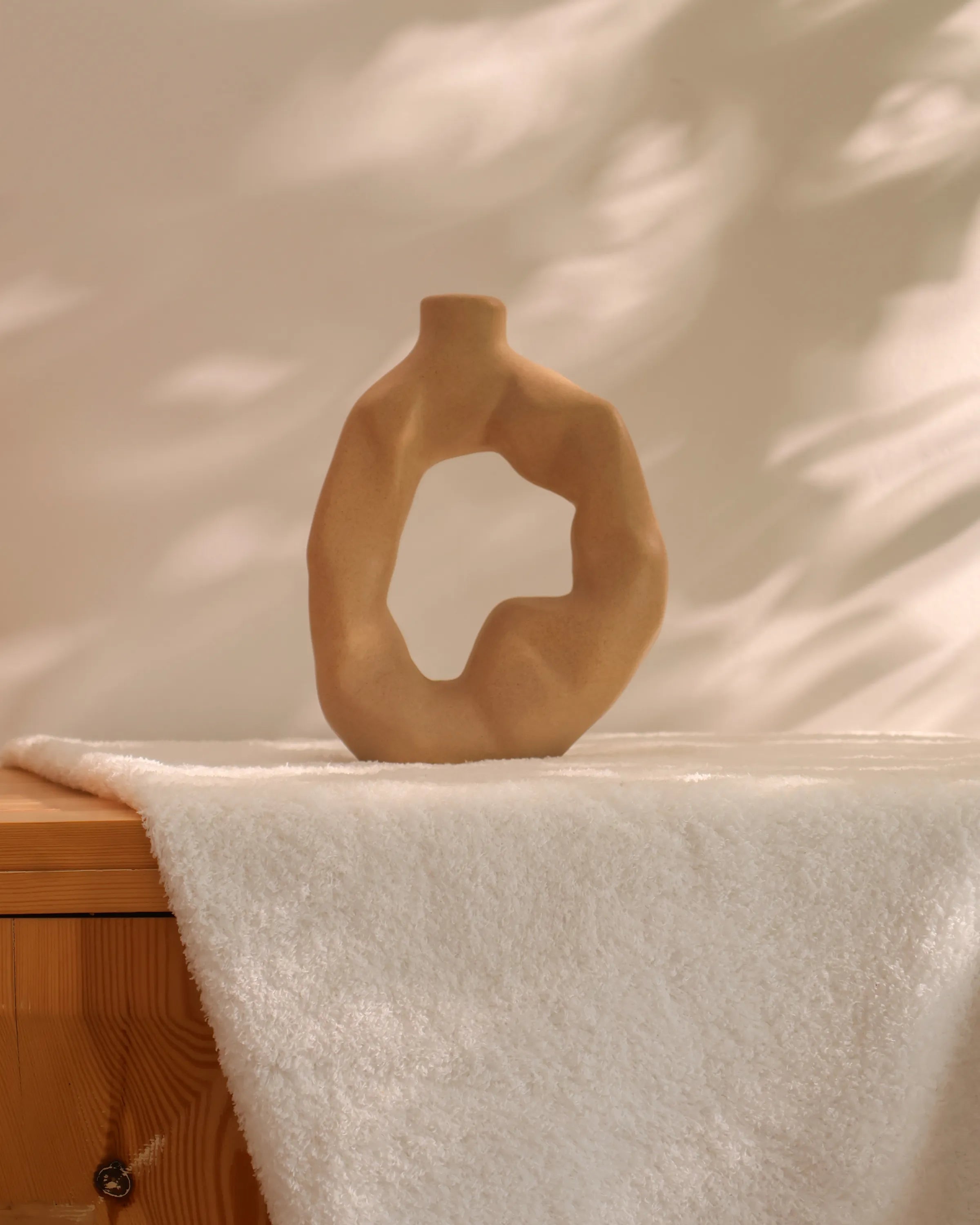 Handcrafted Ora decor piece in beige finish by Stonia.
