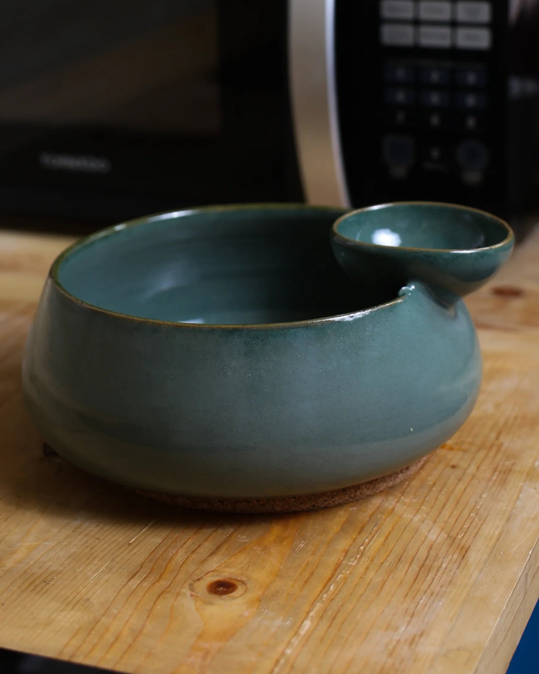 Handcrafted ORBIT serving plate in olive green finish by Stonia.