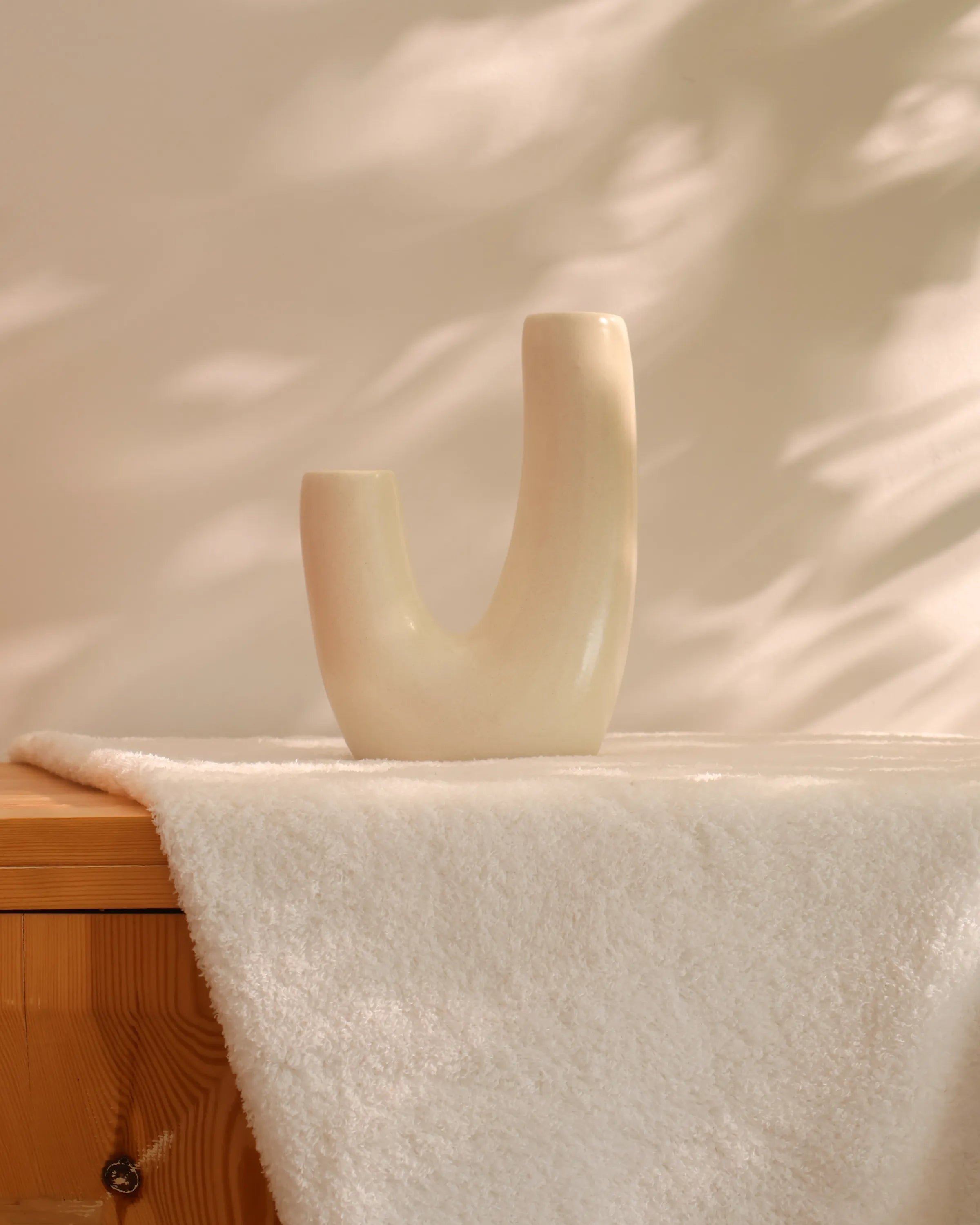 Handcrafted Swingy decor piece in off white finish by Stonia.