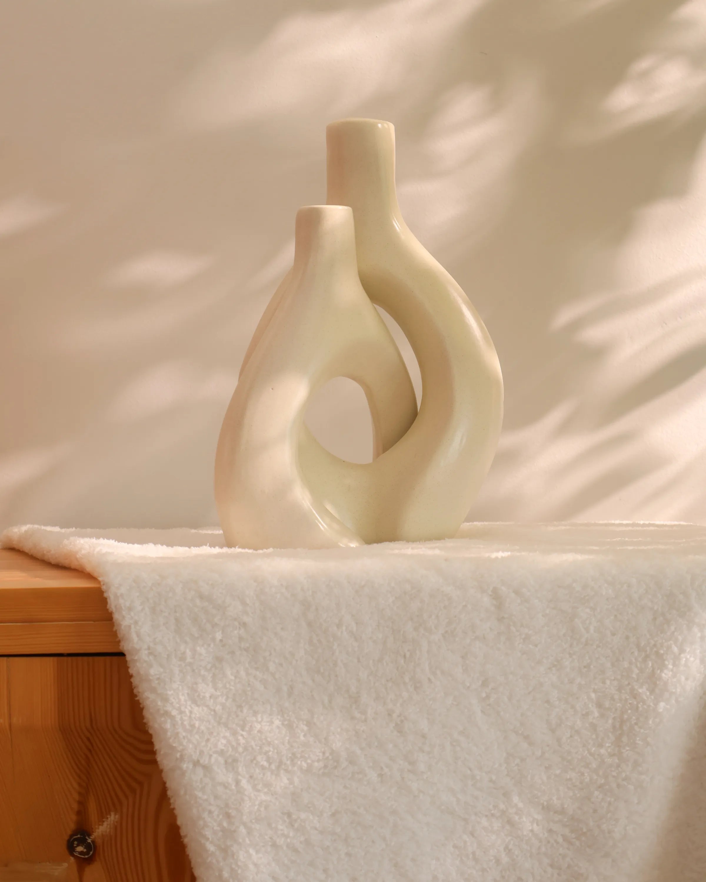 Handcrafted Tango decor piece in off white finish by Stonia.