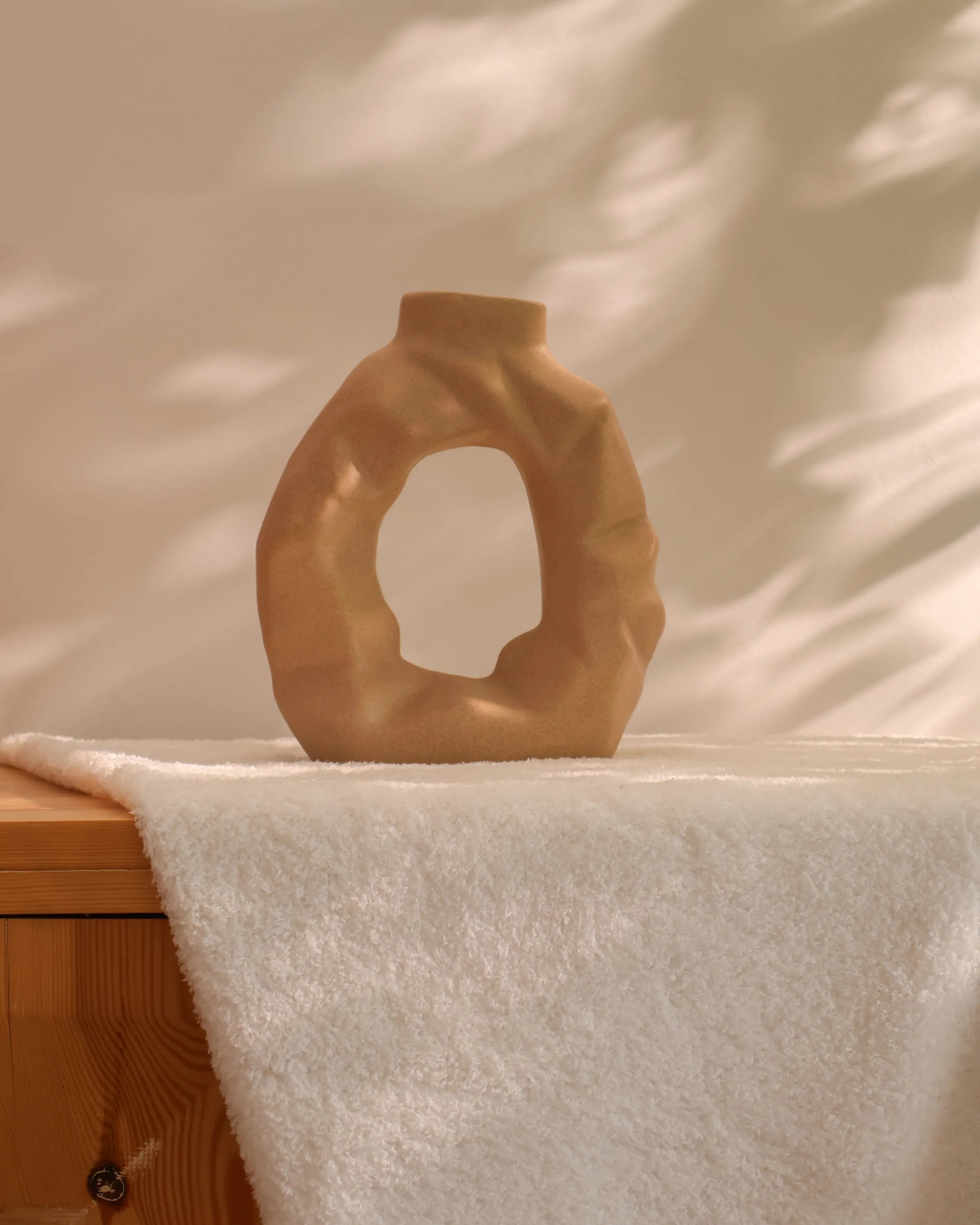 Handcrafted The Crush decor piece in beige finish by Stonia.
